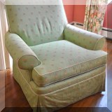 F20. Green upholstered floral club chair. 32”h x 37”w x 36”d 